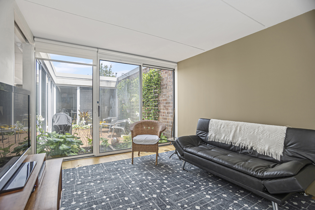 1739 Seton Road Northbrook, IL 60062 - Photo 17 of 31 a living room with furniture and a floor to ceiling window