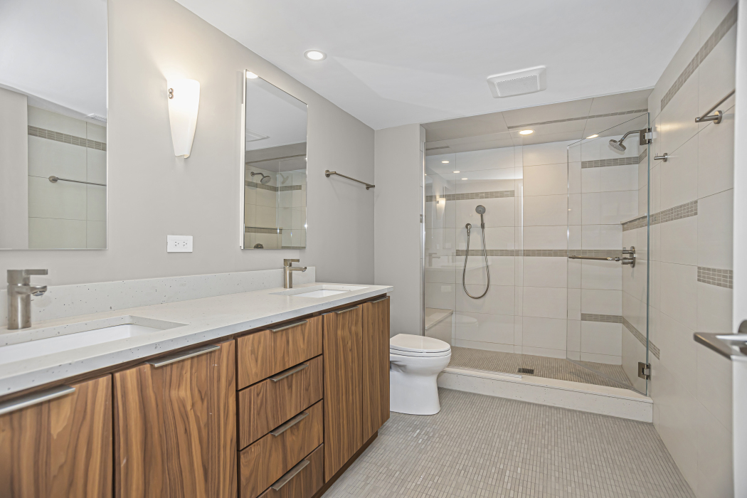 1739 Seton Road Northbrook, IL 60062 - Photo 19 of 31 a bathroom with a double vanity sink toilet and shower