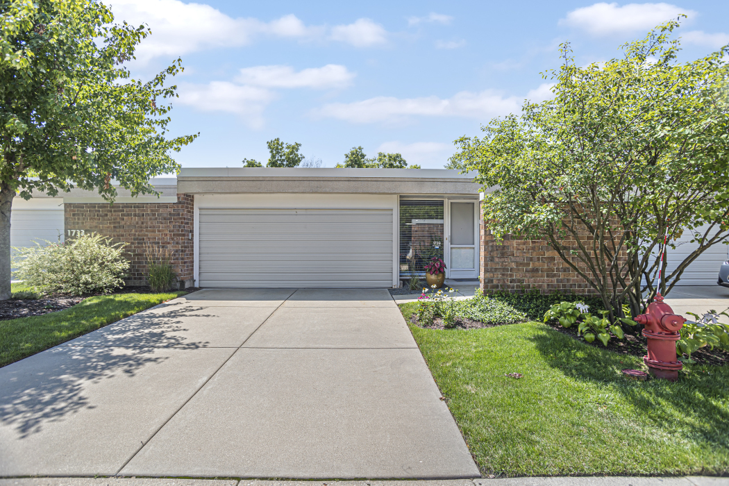 1739 Seton Road Northbrook, IL 60062 - Photo 2 of 31 a front view of a house with a yard and a garage