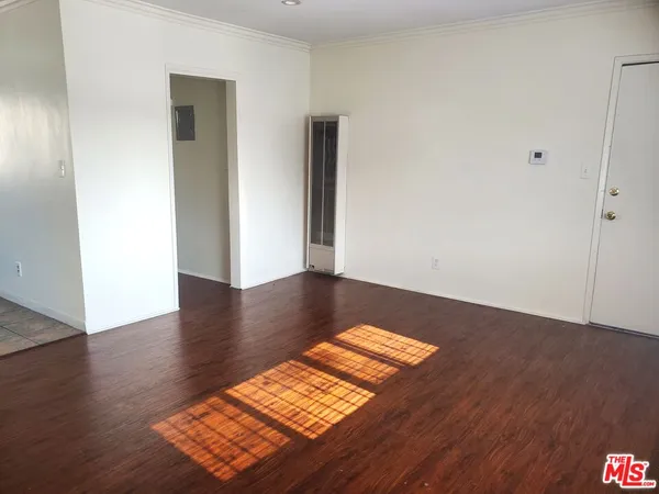 a view of wooden floor in an empty room