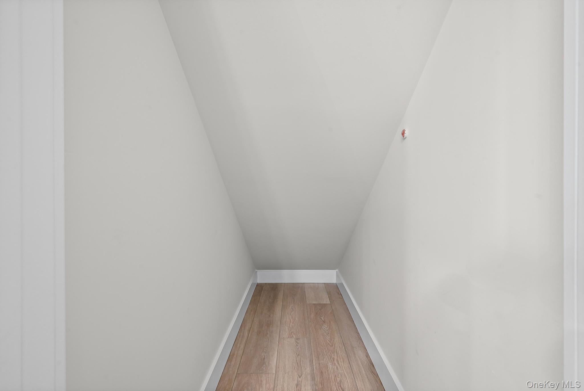 80 Division Street, Unit 3G Patchogue, NY 11772 - Photo 10 of 14 a view of wooden floor in a bathroom