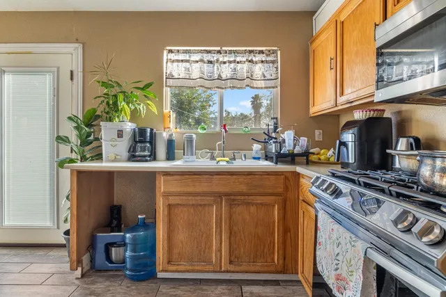 a kitchen with a stove and a microwave