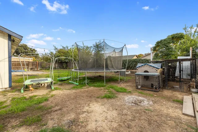 a view of a park with swings and slides
