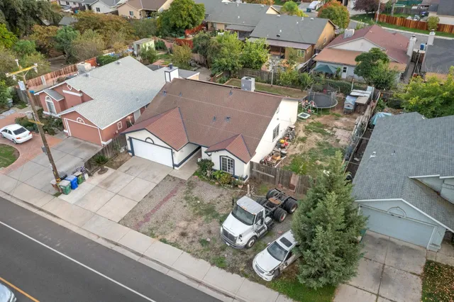 an aerial view of house with yard