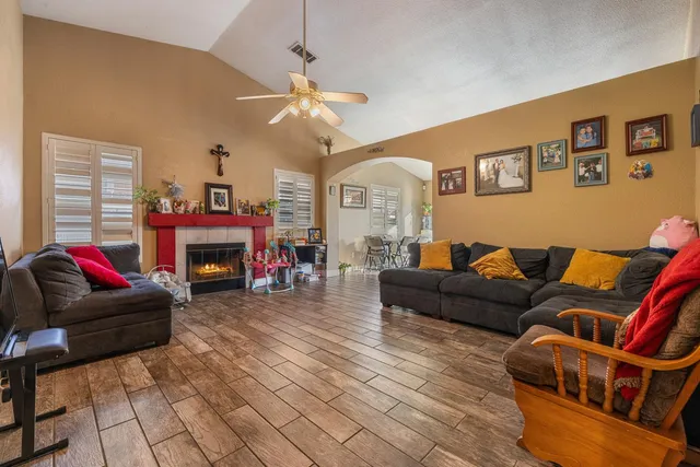 a living room with furniture and a fireplace