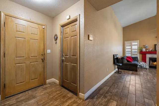 a view of a livingroom with wooden floor and closet