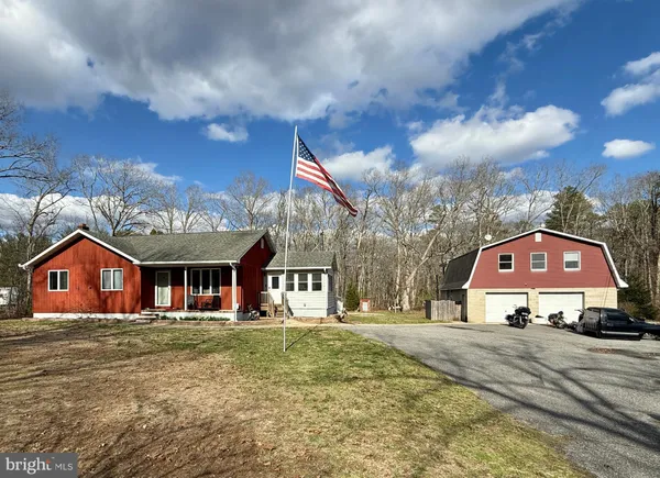 a view of multiple houses with a big yard