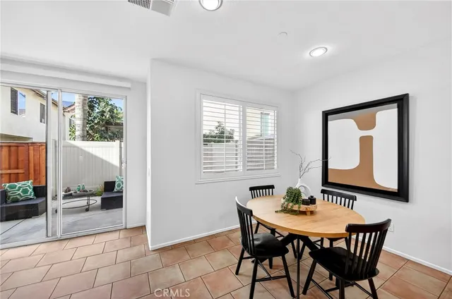 a view of a dining room with furniture and window