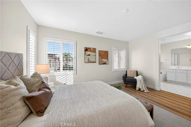 a bedroom with a bed and a couch