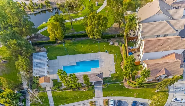 an aerial view of a house with a garden and plants