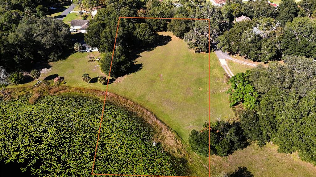 140 East Lemon Street Lady Lake, FL 32159 - Photo 17 of 18 a view of a yard