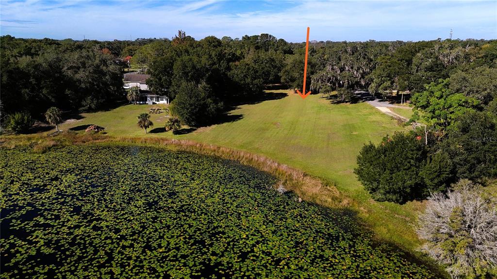 140 East Lemon Street Lady Lake, FL 32159 - Photo 18 of 18 a view of a houses with a yard