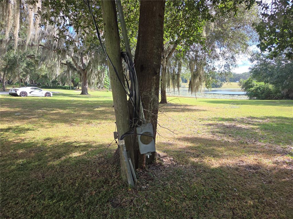 140 East Lemon Street Lady Lake, FL 32159 - Photo 6 of 18 a view of a lake with a yard
