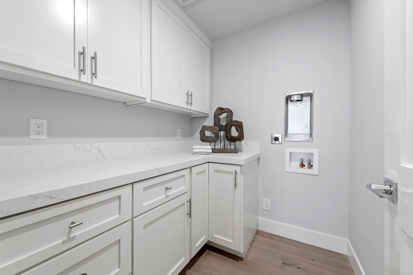 2647 Phillips Avenue Santa Clara, CA 95051 - Photo 18 of 22 a kitchen with white cabinets and sink