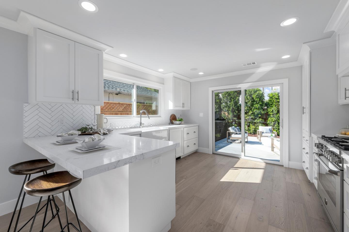 2647 Phillips Avenue Santa Clara, CA 95051 - Photo 7 of 22 a kitchen with stainless steel appliances kitchen island granite countertop a table and chairs in it