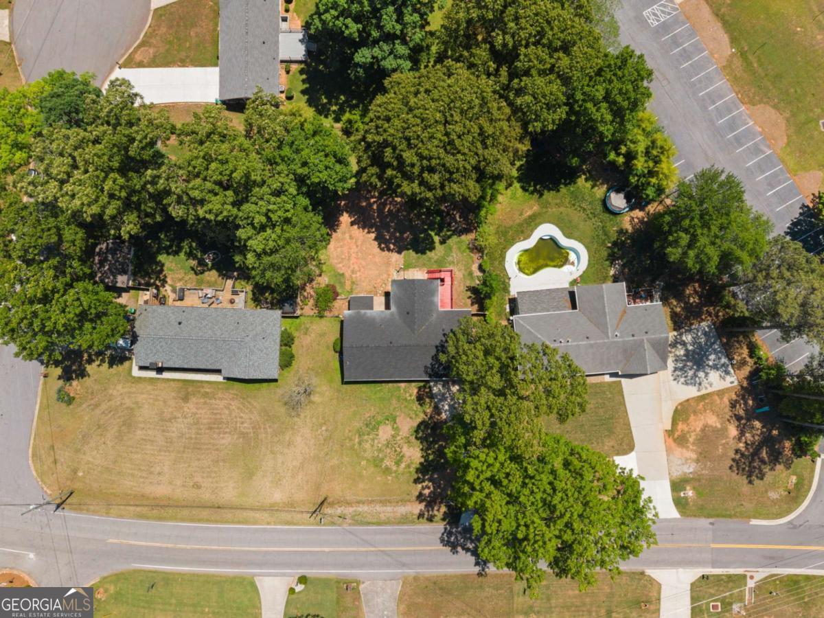 865 Old Tucker Road Stone Mountain, GA 30087 - Photo 52 of 57 an aerial view of a house with swimming pool