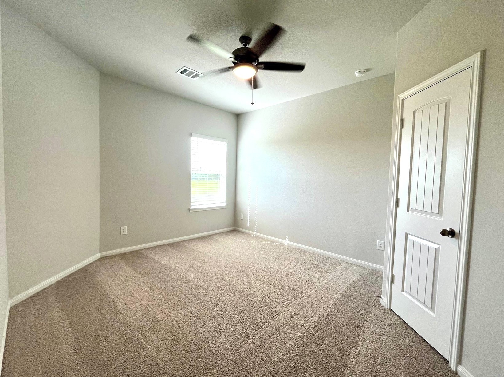4814 Blue Jacaranda Way Spring, TX 77373 - Photo 12 of 19 an empty room with fan and windows