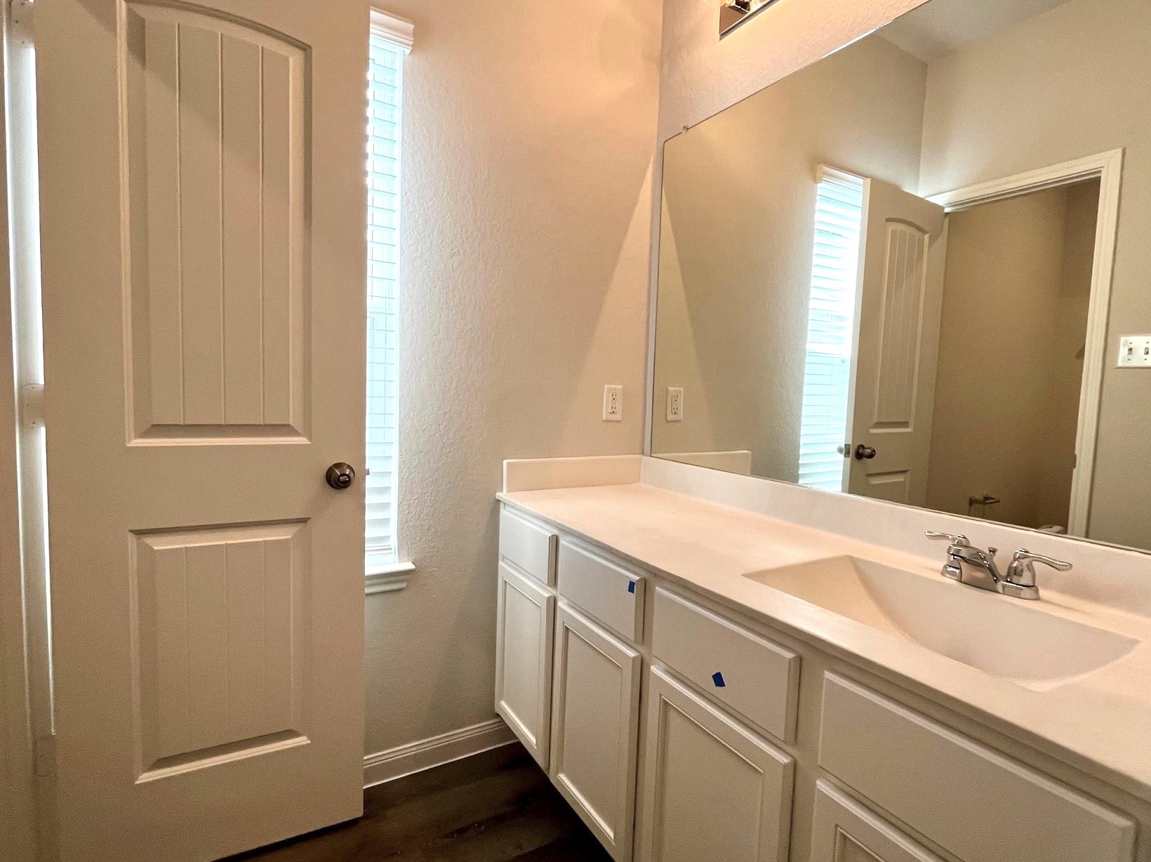 4814 Blue Jacaranda Way Spring, TX 77373 - Photo 16 of 19 a bathroom with a double vanity sink and a mirror