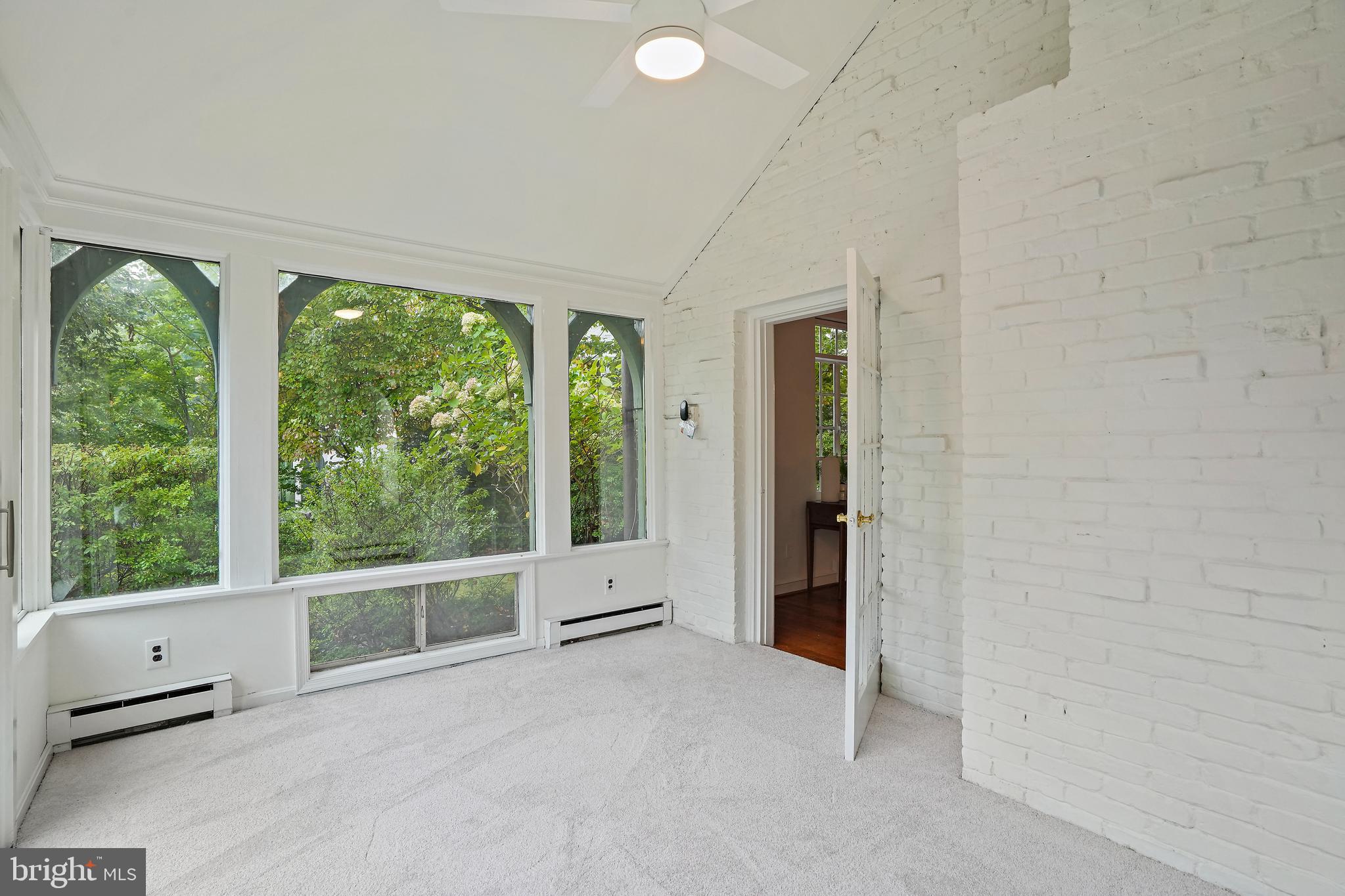 3112 Rolling Road Chevy Chase, MD 20815 - Photo 17 of 38 an empty room with windows and view