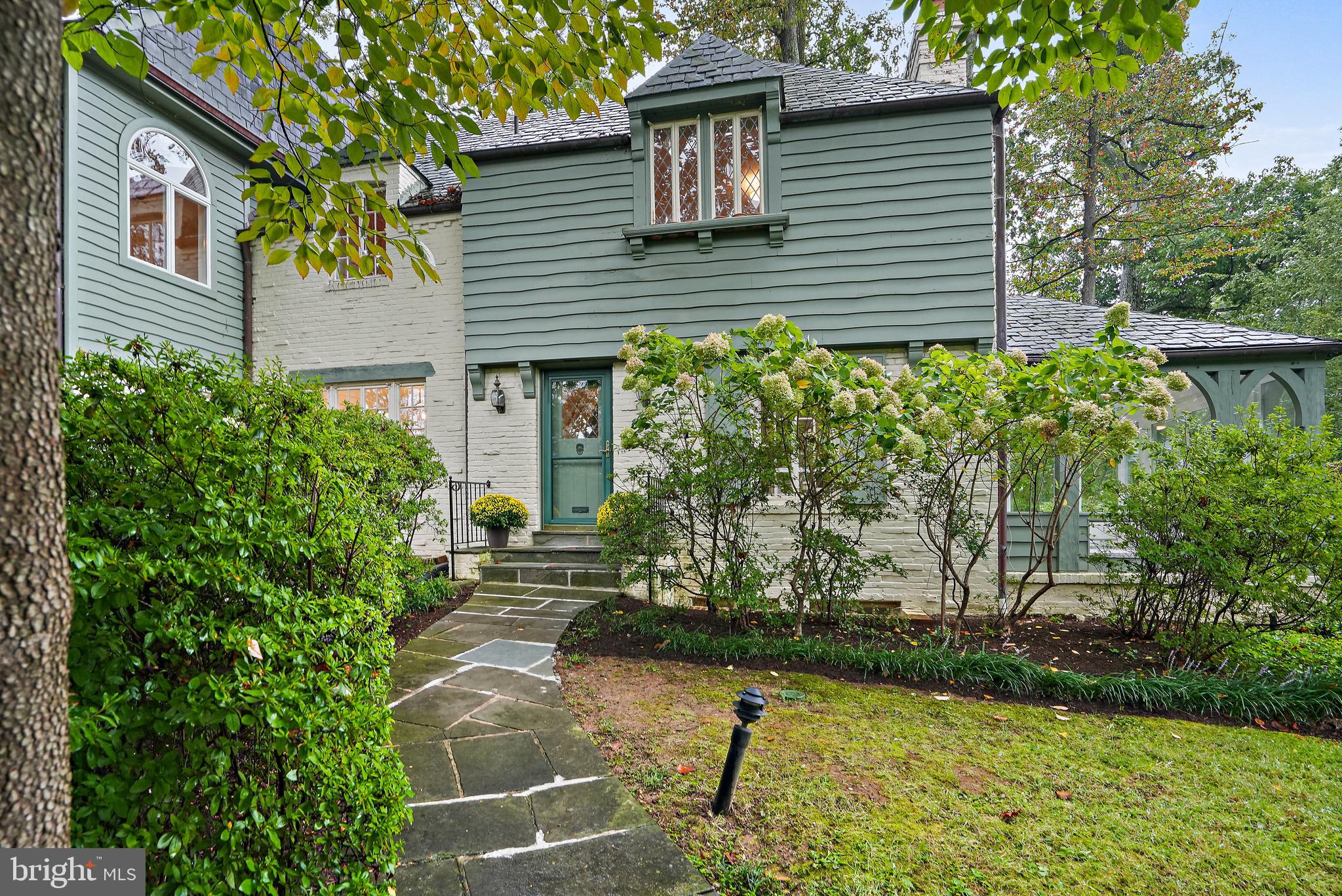 3112 Rolling Road Chevy Chase, MD 20815 - Photo 2 of 38 a house that has a tree in front of it