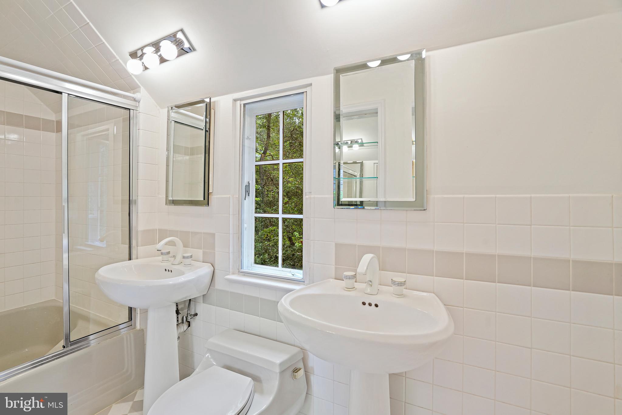 3112 Rolling Road Chevy Chase, MD 20815 - Photo 29 of 38 a bathroom with a sink a toilet and shower