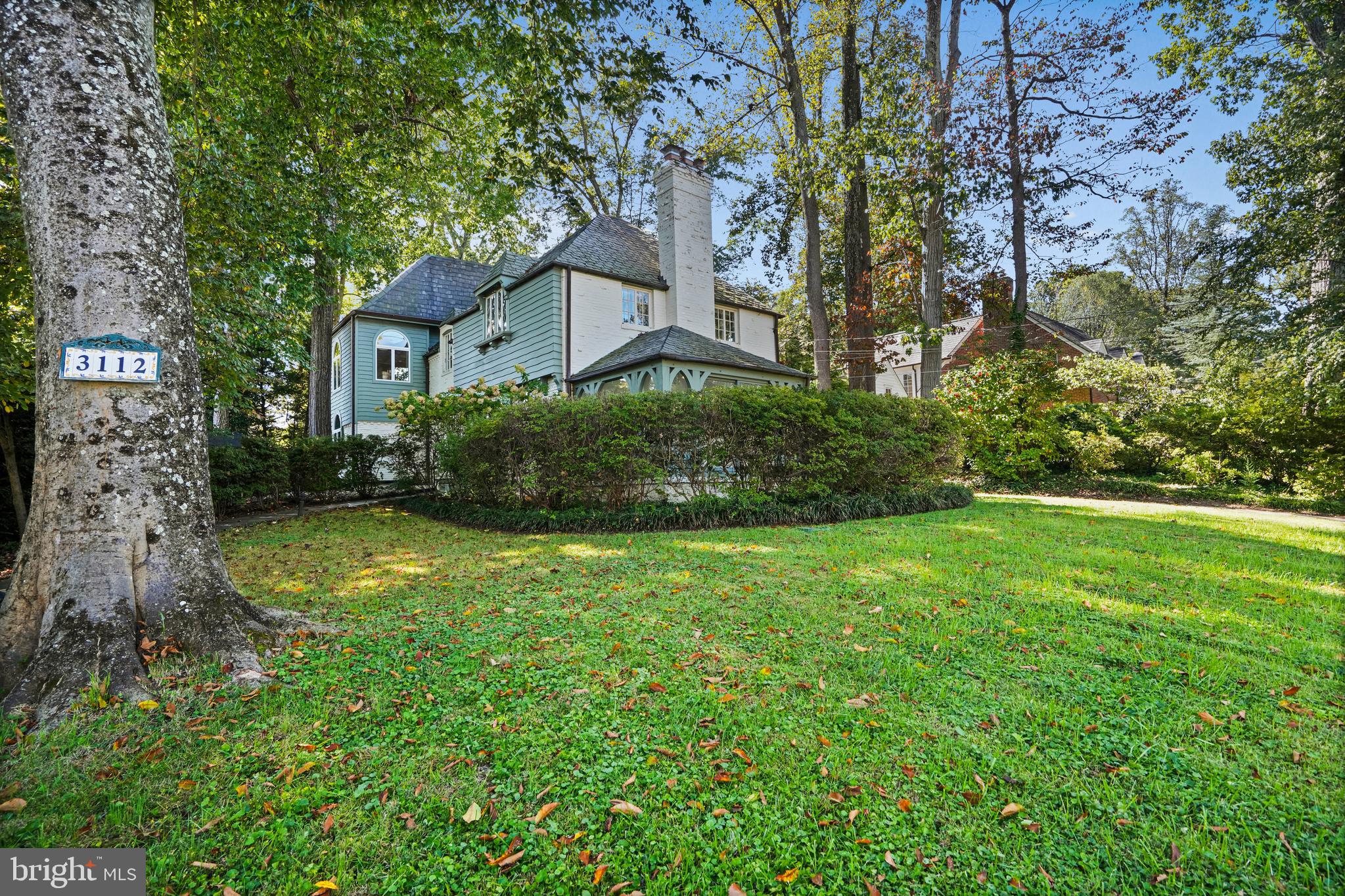 3112 Rolling Road Chevy Chase, MD 20815 - Photo 3 of 38 a view of a house with garden and trees