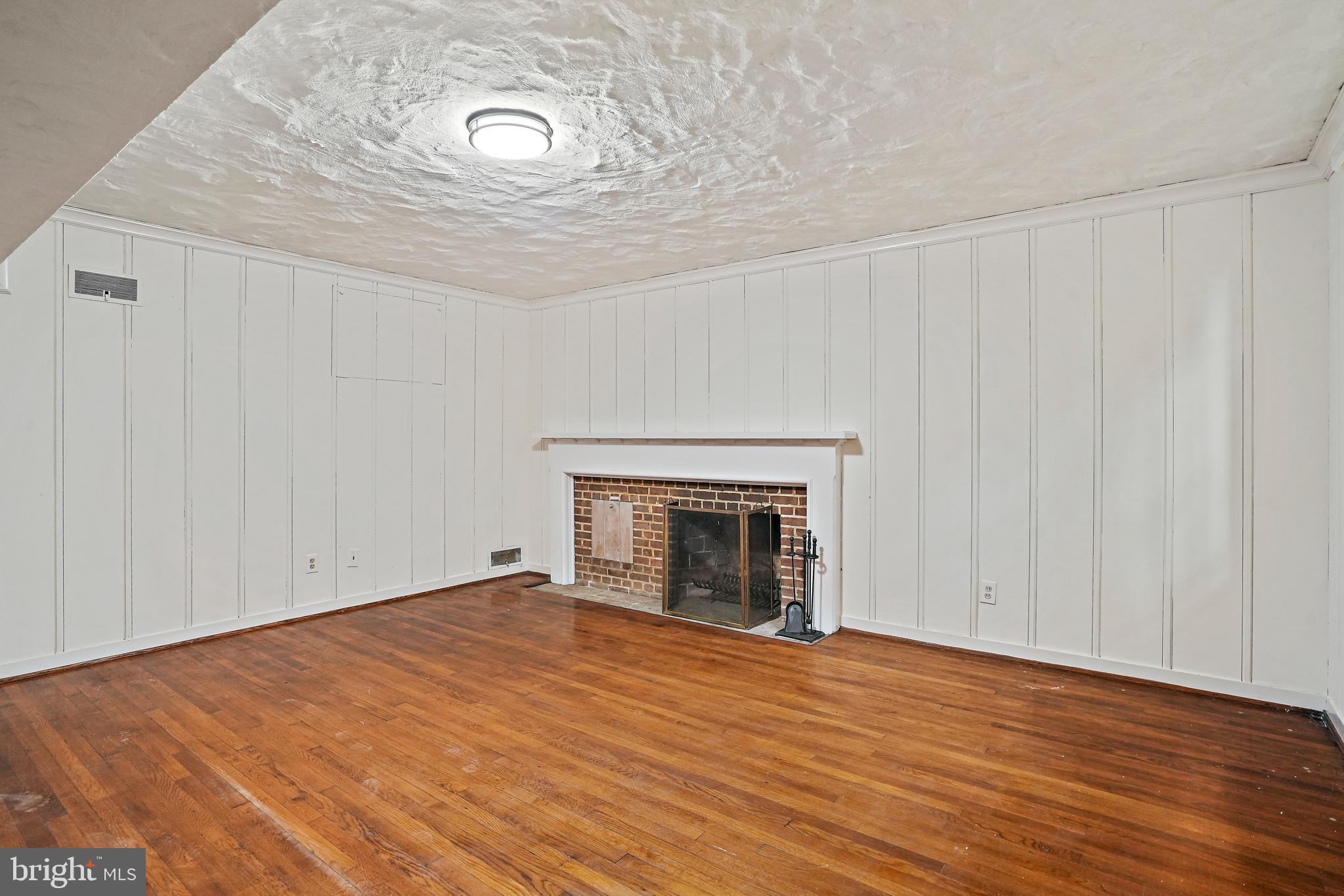 3112 Rolling Road Chevy Chase, MD 20815 - Photo 32 of 38 a view of empty room with wooden floor