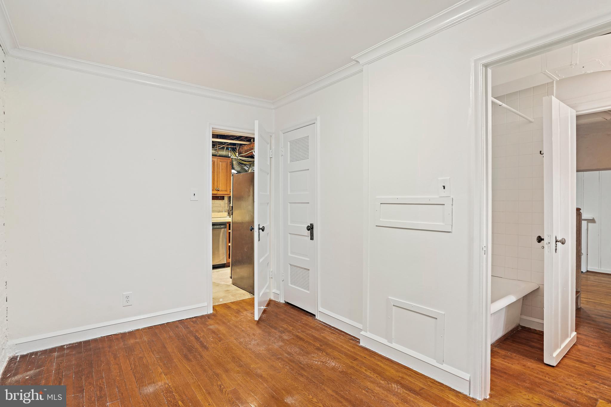 3112 Rolling Road Chevy Chase, MD 20815 - Photo 35 of 38 a view of an empty room with wooden floor