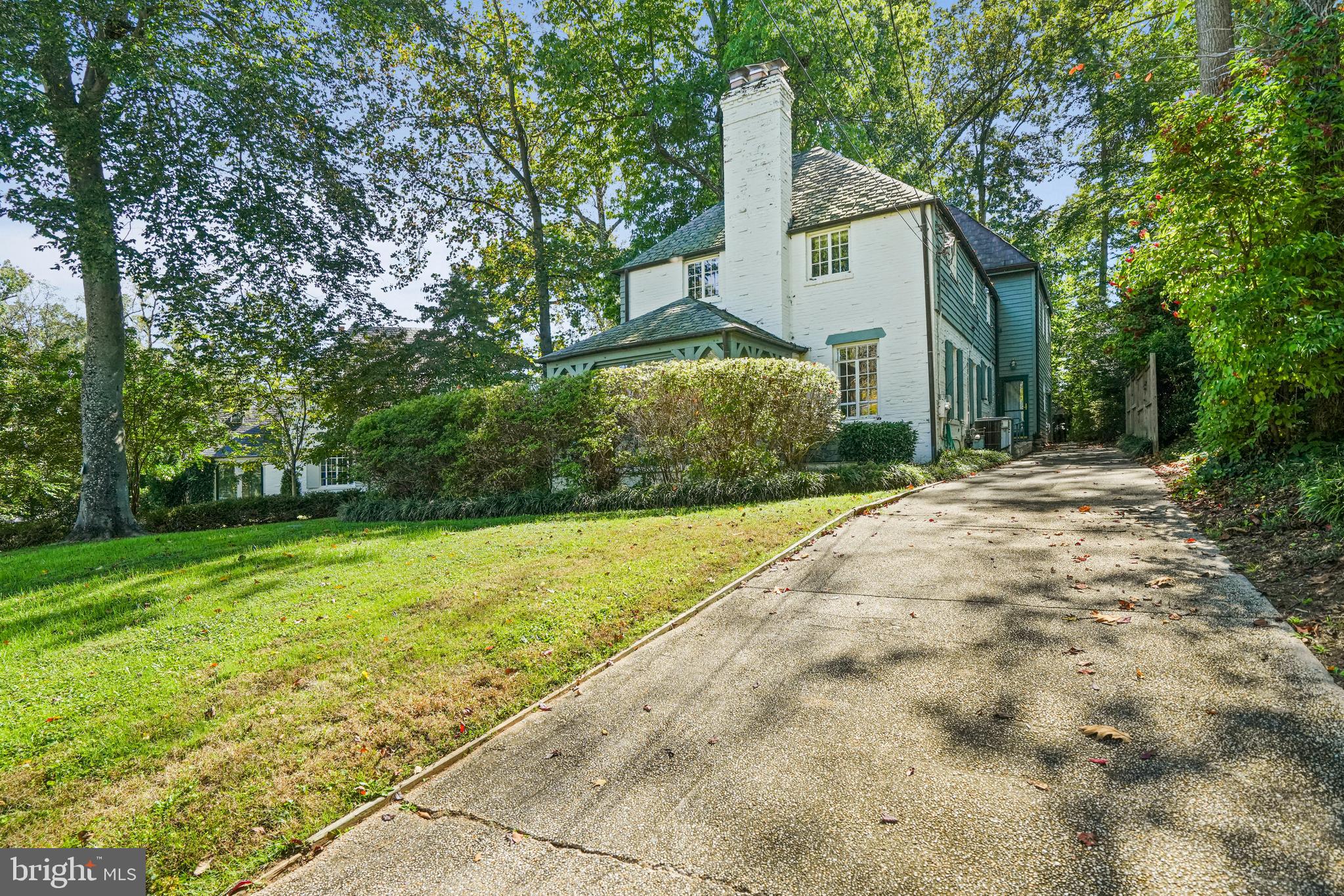 3112 Rolling Road Chevy Chase, MD 20815 - Photo 36 of 38 a front view of a house with garden