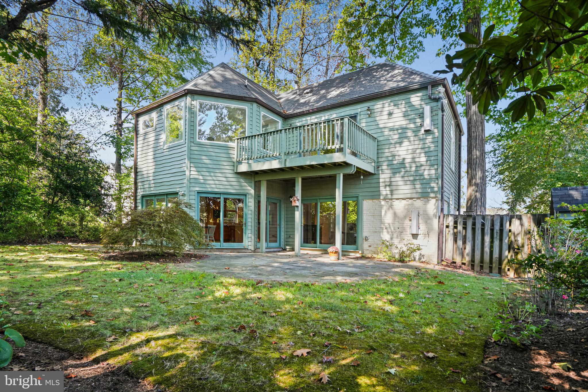 3112 Rolling Road Chevy Chase, MD 20815 - Photo 37 of 38 a front view of a house with a garden and plants