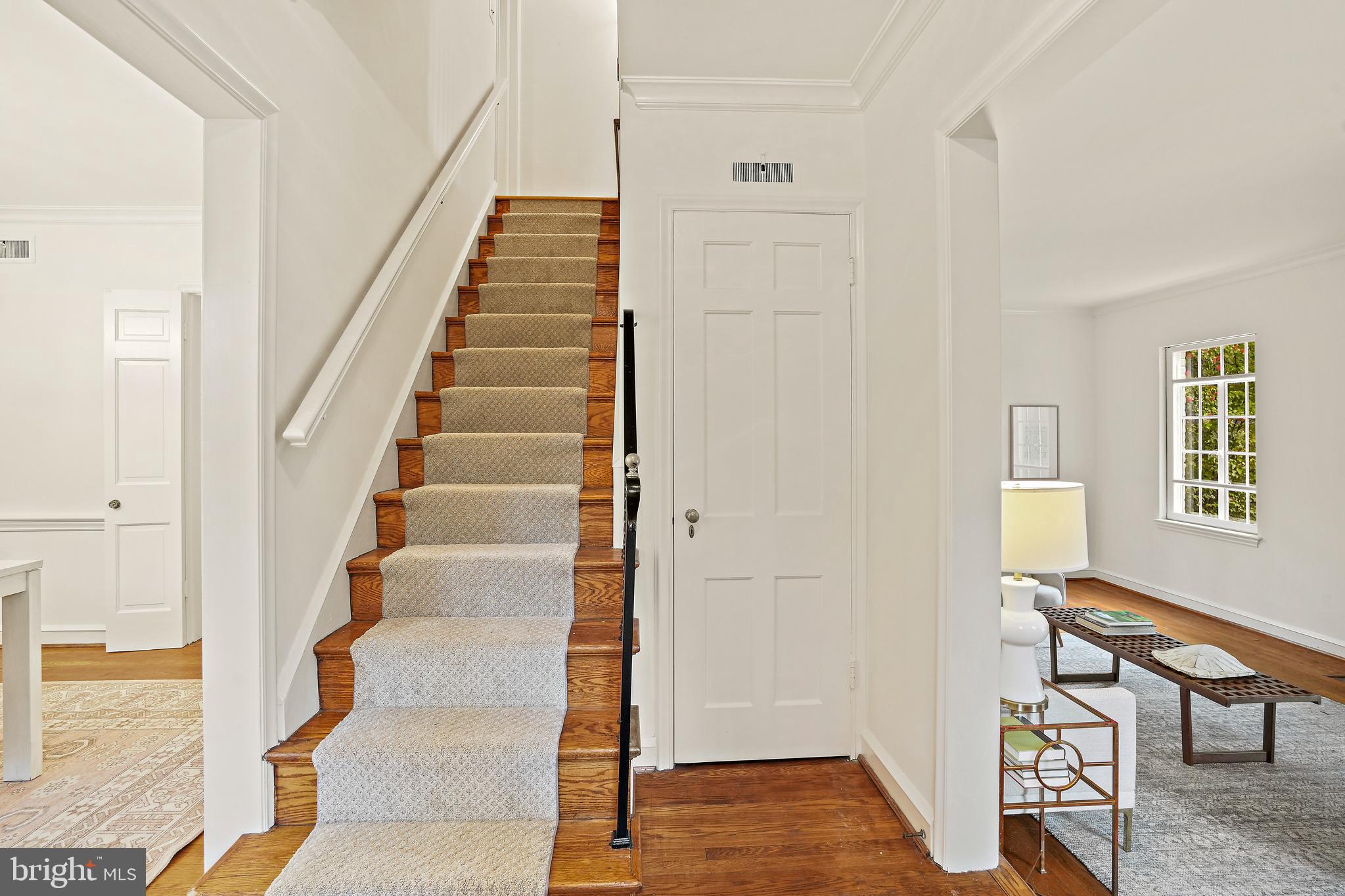 3112 Rolling Road Chevy Chase, MD 20815 - Photo 4 of 38 a view of entryway with wooden floor and stairs