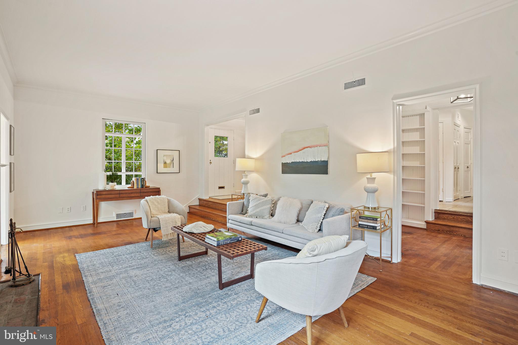 3112 Rolling Road Chevy Chase, MD 20815 - Photo 5 of 38 a living room with furniture and a wooden floor