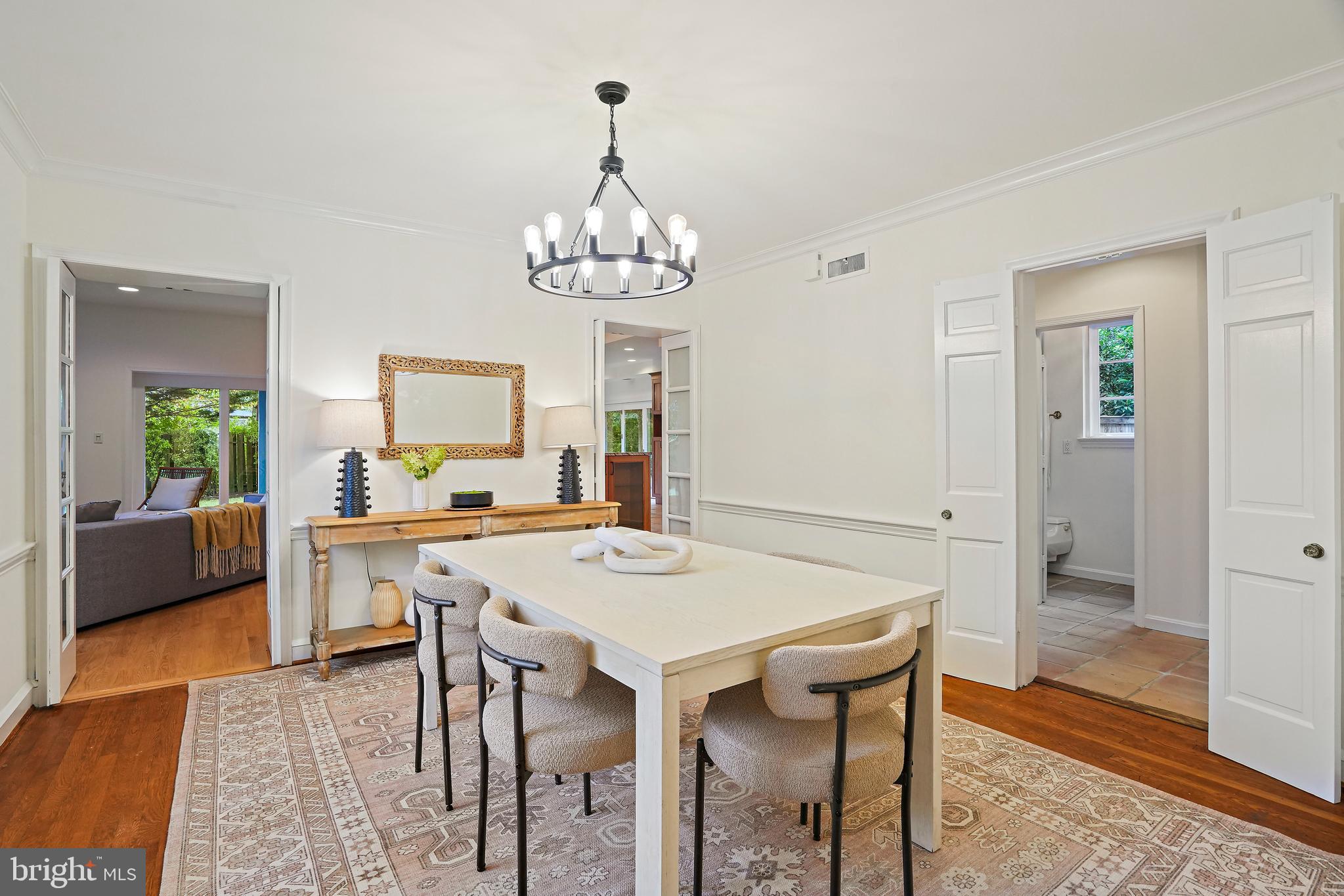 3112 Rolling Road Chevy Chase, MD 20815 - Photo 6 of 38 a view of a dining room with furniture and wooden floor