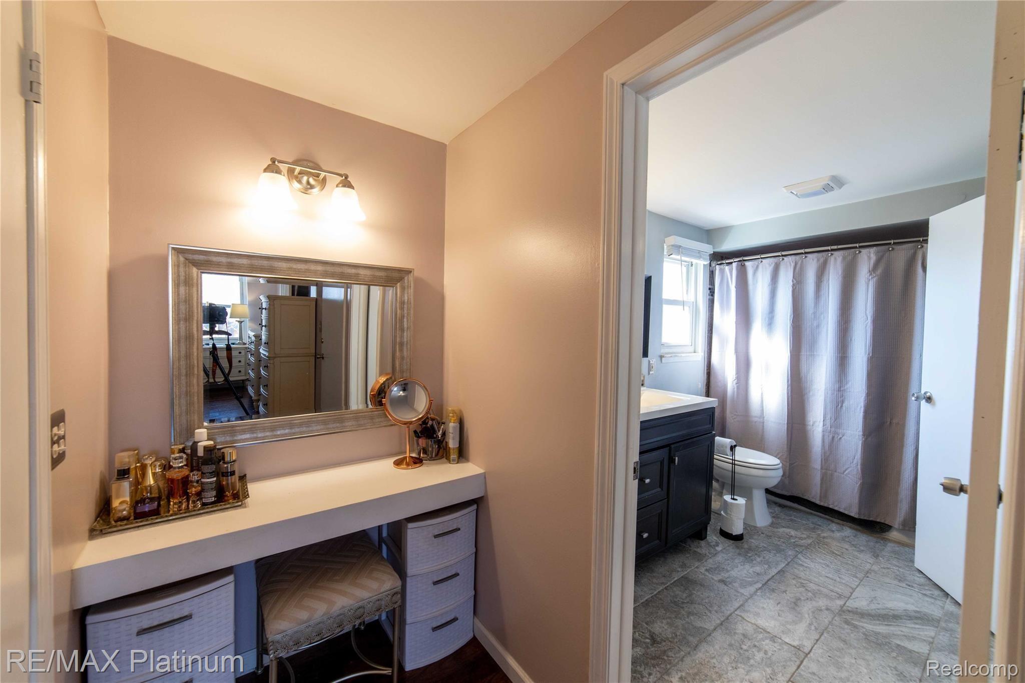 42289 Hanford Road Canton, MI 48187 - Photo 18 of 29 Master bedroom vanity with access to full bathroom