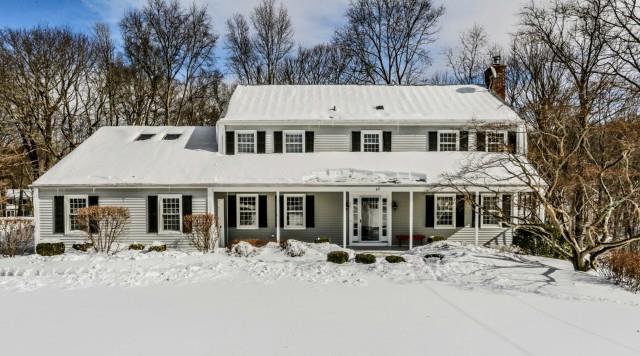 69 Powder Horn Drive Ridgefield, CT 06877 - Photo 1 of 1 a view of a white house with a large tree in front of it