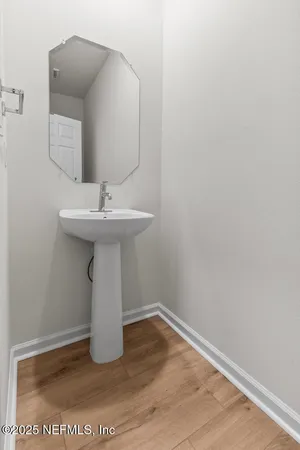 a bathroom with a sink and mirror