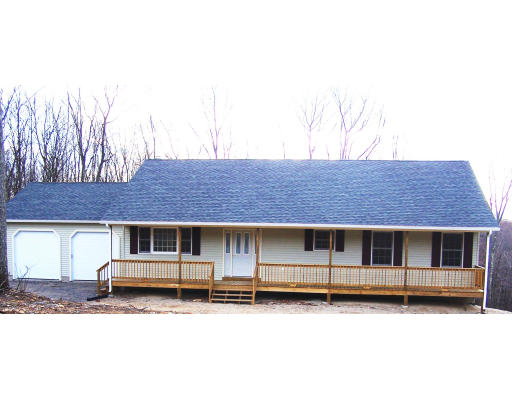 Lot 9 Shaw Road Wales, MA 01081 - Photo 3 of 13 a front view of a house with a garden