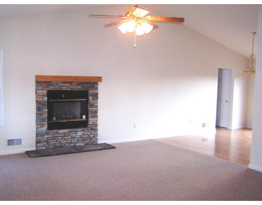 Lot 9 Shaw Road Wales, MA 01081 - Photo 6 of 13 a view of an empty room with a fireplace and a fan
