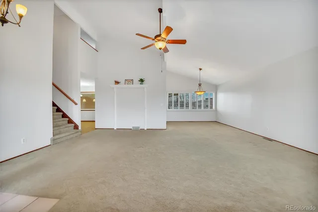 a view of a livingroom with a ceiling fan