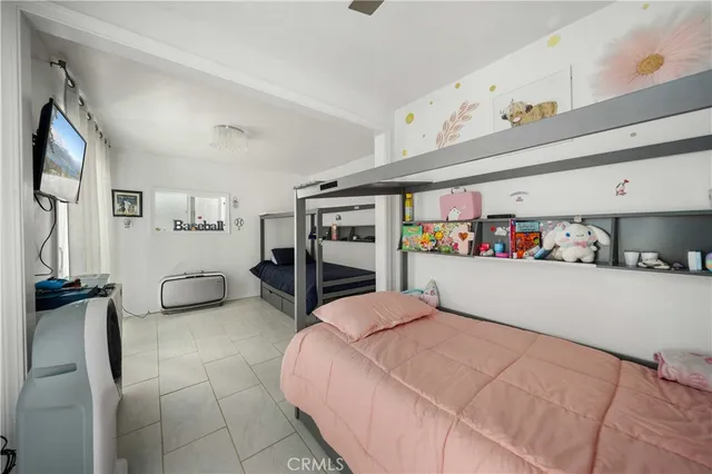 a bedroom with furniture and a book shelf