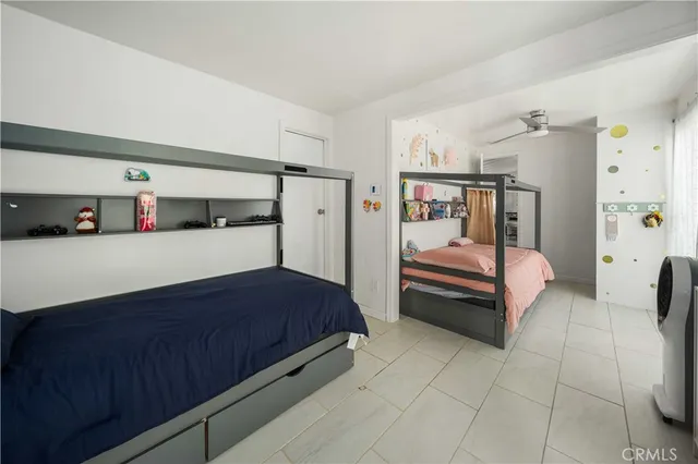 a bedroom with a bed and a cabinets