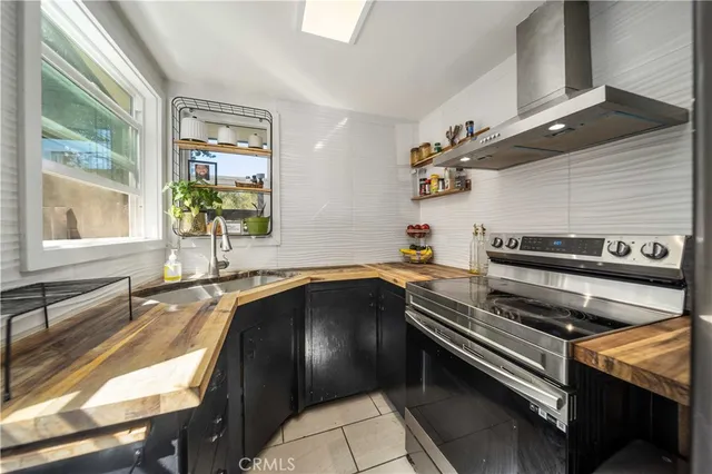 a kitchen with table and chairs
