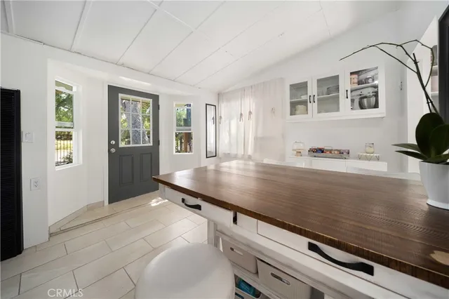 a view of kitchen with furniture and wooden floor