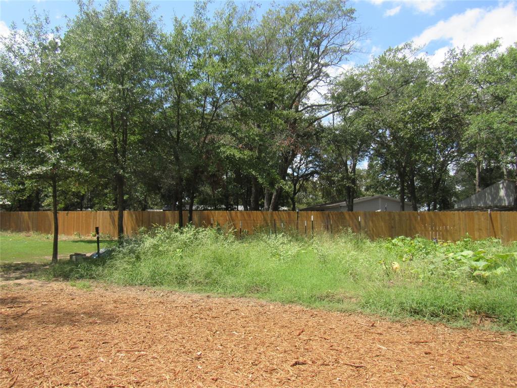 7305 Lakeview Drive Bonham, TX 75418 - Photo 16 of 19 a backyard of a house with lots of green space and lake view