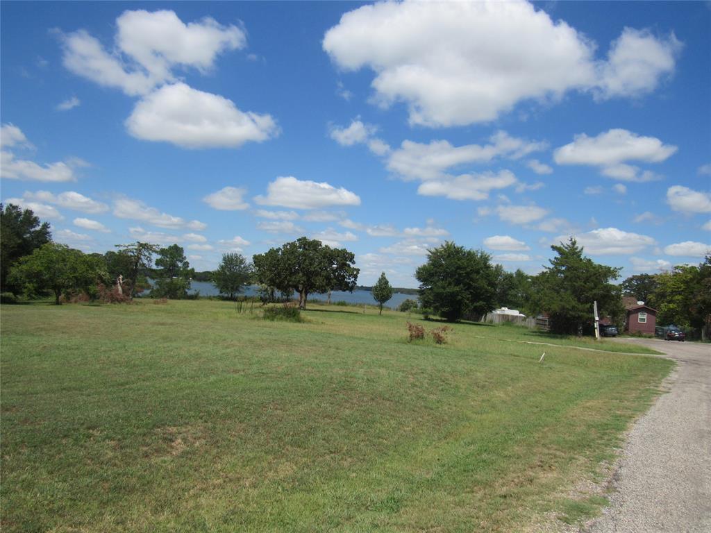 7305 Lakeview Drive Bonham, TX 75418 - Photo 18 of 19 a view of a golf course with a lake