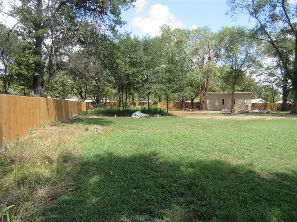 7305 Lakeview Drive Bonham, TX 75418 - Photo 8 of 19 a view of a park with large trees