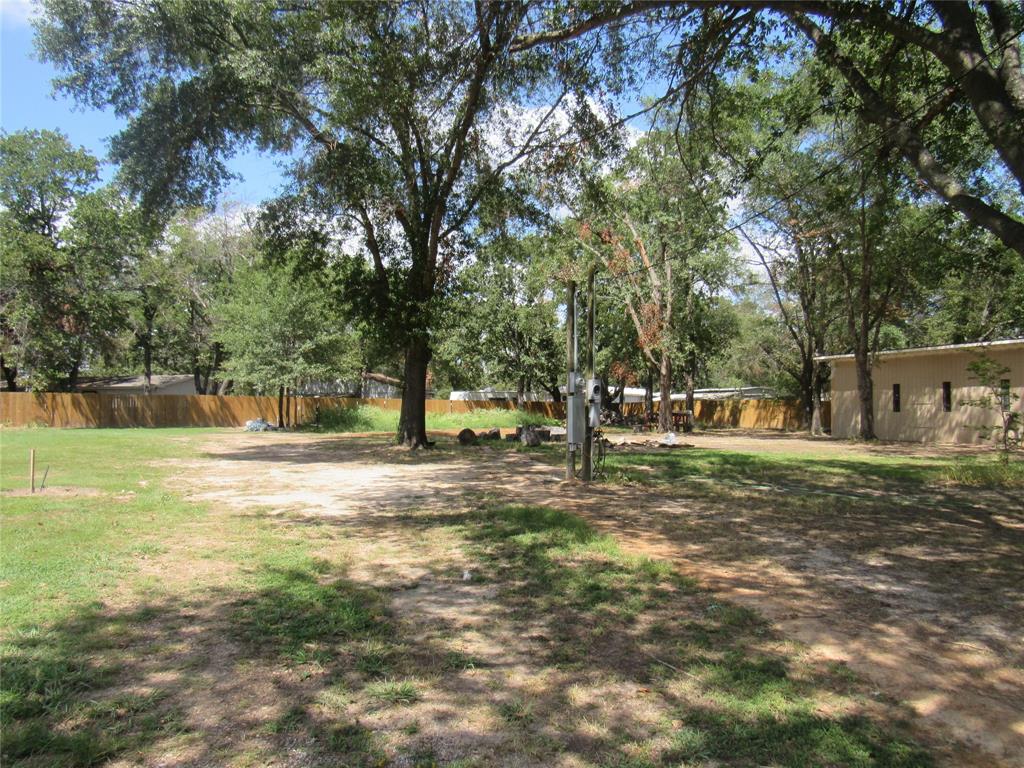 7305 Lakeview Drive Bonham, TX 75418 - Photo 9 of 19 a view of a yard with a tree