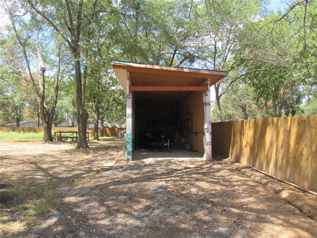 7305 Lakeview Drive Bonham, TX 75418 - Photo 10 of 19 a backyard of a house with table and chairs