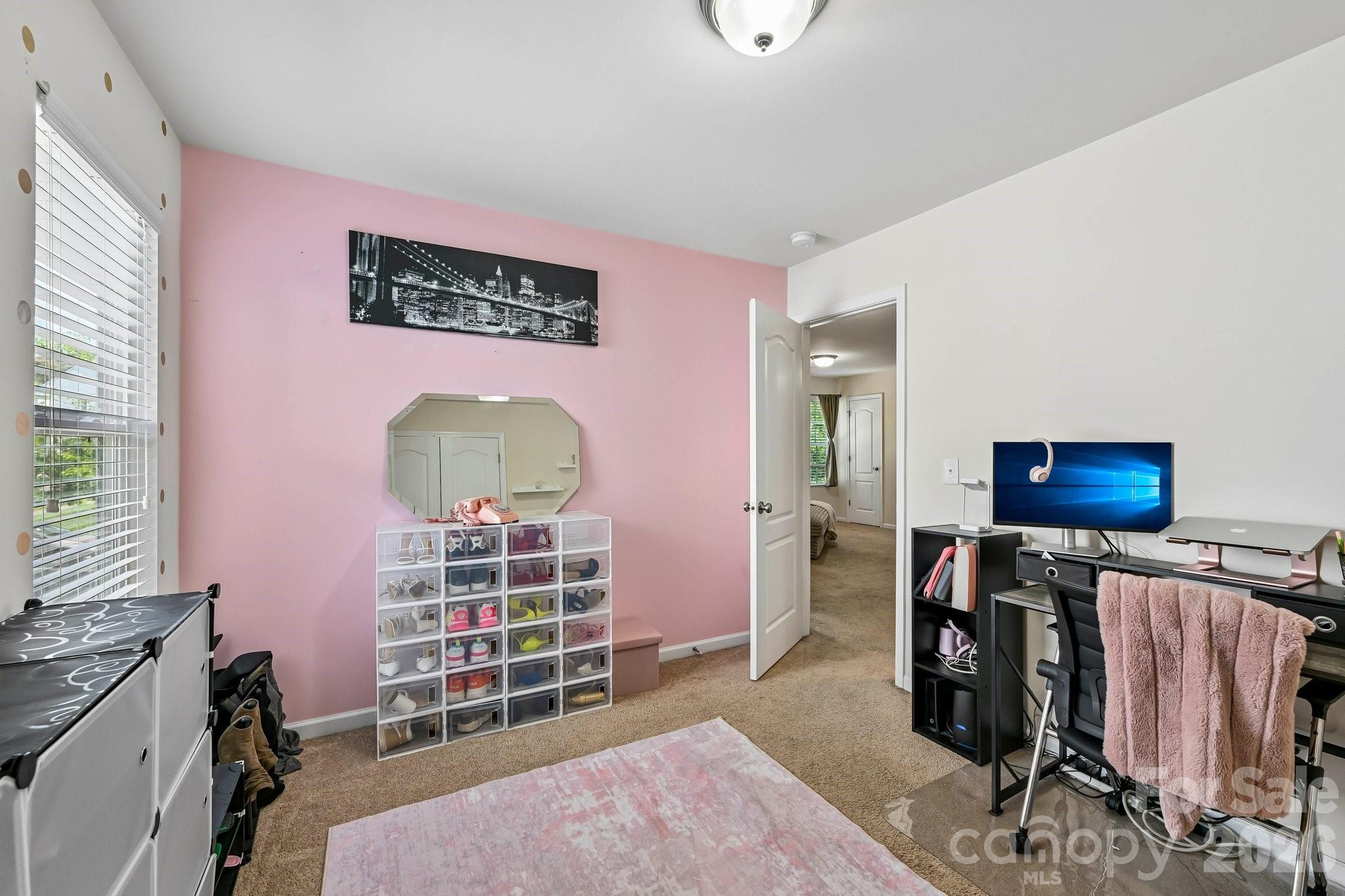 2206 Turtle Point Road Charlotte, NC 28262 - Photo 24 of 28 a bedroom with furniture and a window