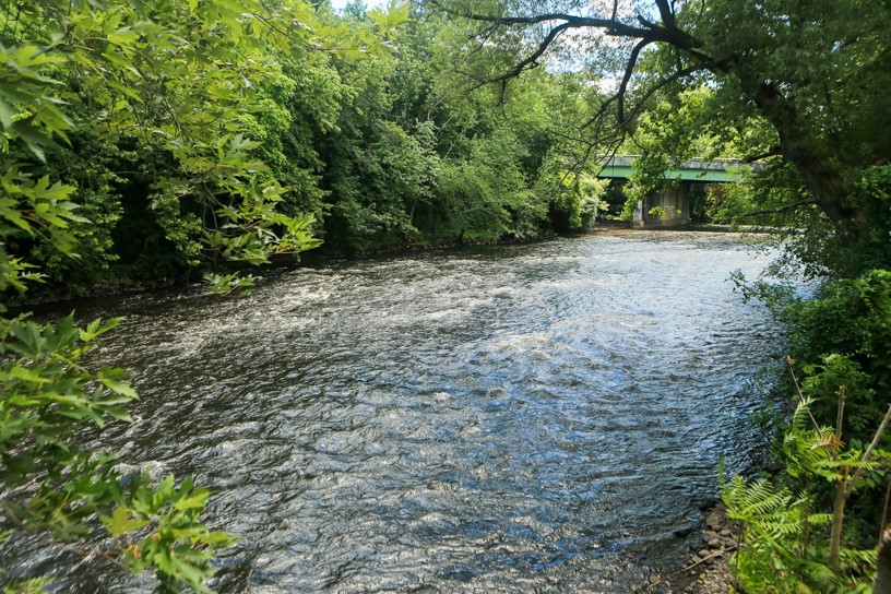 99 Allen Street, Unit 117 Woonsocket, RI 02895 - Photo 23 of 25 The Blackstone River from the grounds of the Lofts at Allen Street